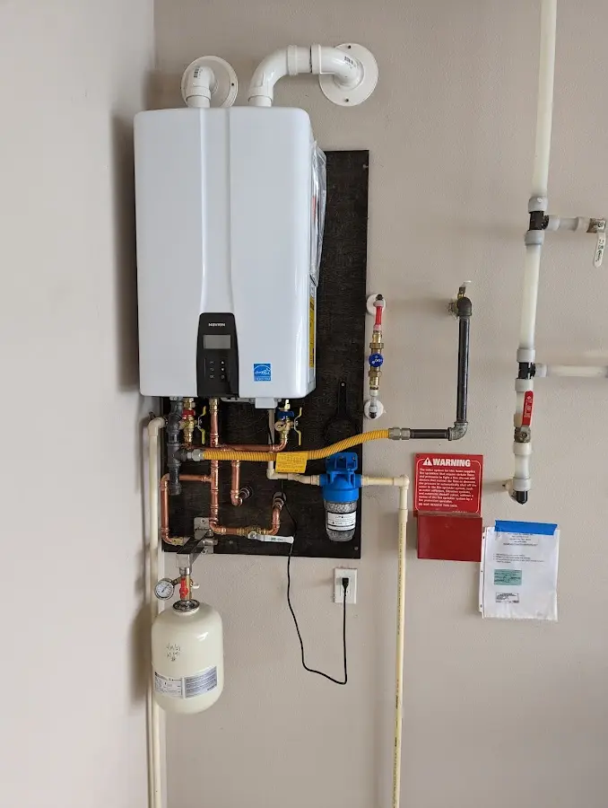 Professional plumber installing copper piping in a Desert Edge home